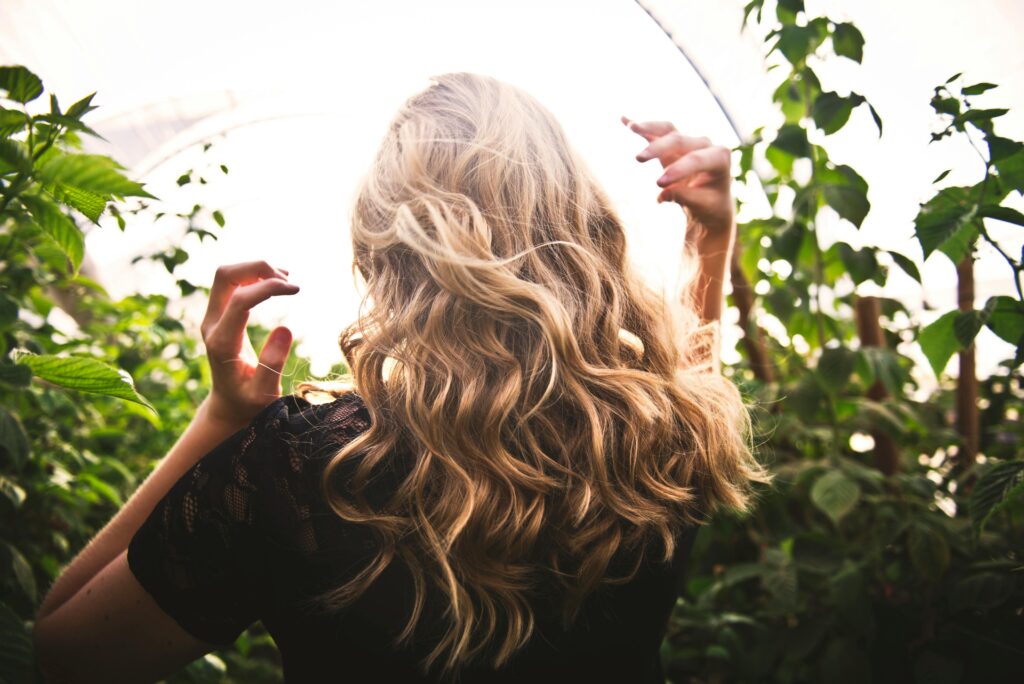 back view of woman with wavy hair