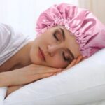 woman sleeping with satin bonnet