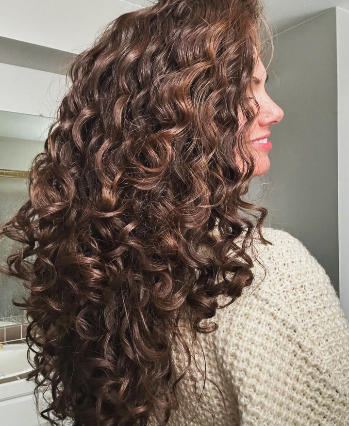 Photo of woman with bouncy curly hair